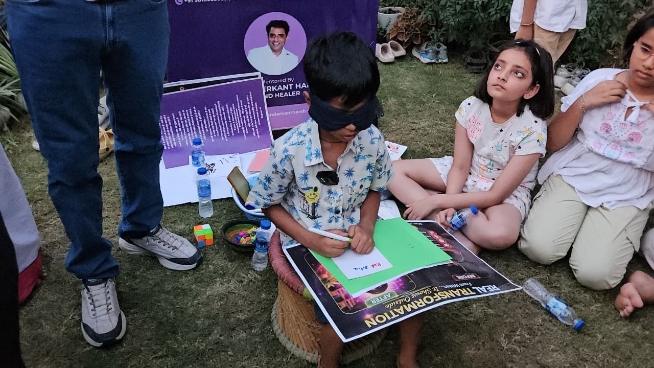 Blindfolded child completing a guided drawing activity outdoors